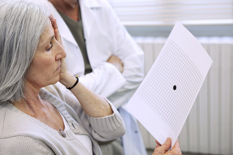  Woman Taking an Amsler Grid Test for Macular Degeneration